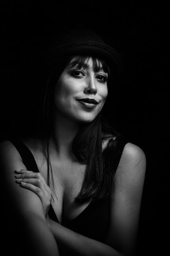Greyscale Photo of Woman Wearing Tank Top and Hat