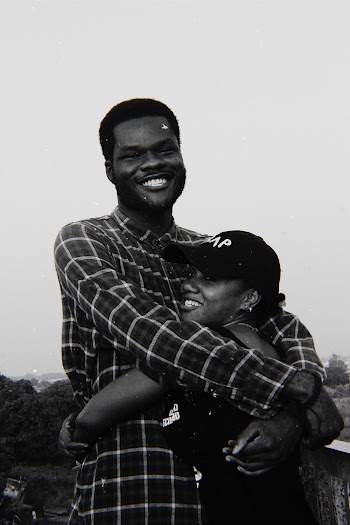 Greyscale Photography of Man and Woman Hugging