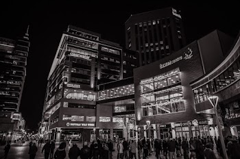 Greyscale Photography of People Walking Outside Building