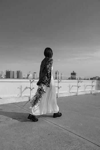 Greyscale Photography of Woman Walking