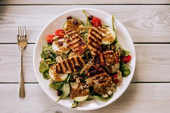 Grilled Dish With Vegetables on Round White Ceramic Plate