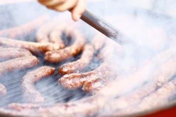 grilling sausage during daytime