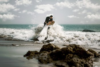 Groom and Bride Standing on Beach Line