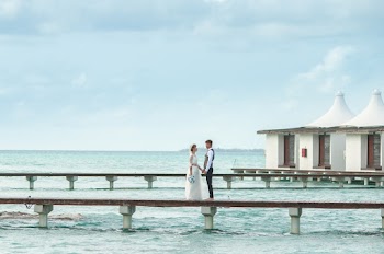 Groom and Bride Standing on Sea Dock