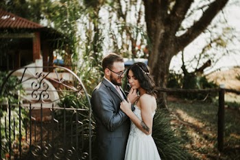 Groom and Bride Standing Outside a Gate