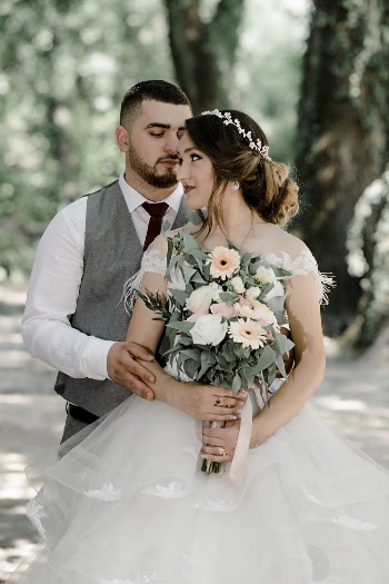 Groom Standing Behind a Bride