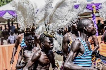 Group Of Boys With White Feather Headdress