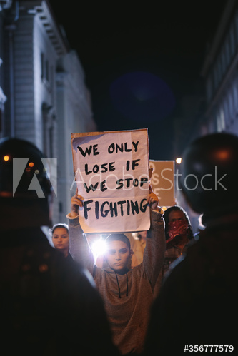 Group of demonstrators in front of police force