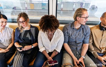 Group of diverse people riding a train
