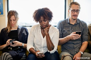 Group of diverse people riding a train