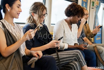 Group of diverse people riding a train