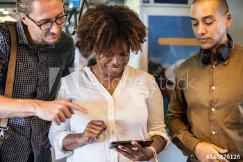 Group of diverse people using a smartphone