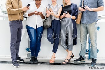 Group of diverse people using smartphones