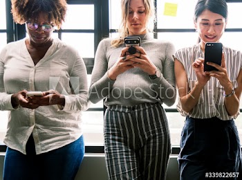 Group of diverse people using smartphones