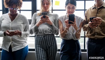 Group of diverse people using smartphones