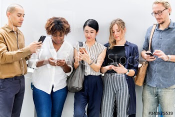 Group of diverse people using smartphones