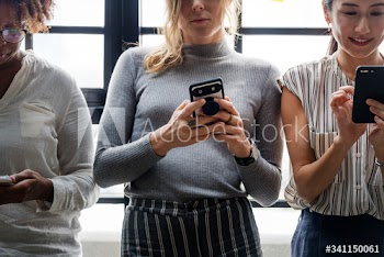 Group of diverse people using smartphones