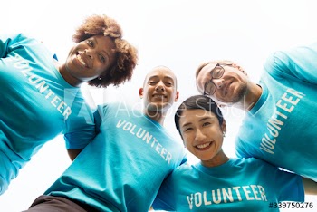 Group of happy and diverse volunteers