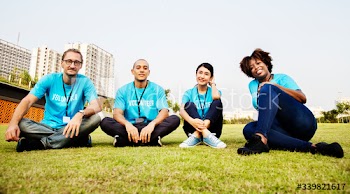 Group of happy and diverse volunteers