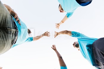 Group of happy and diverse volunteers