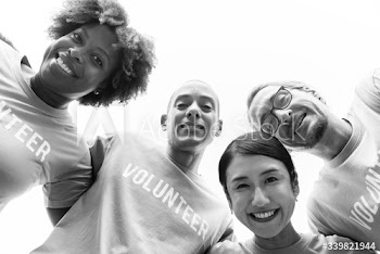 Group of happy and diverse volunteers