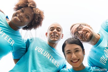 Group of happy and diverse volunteers