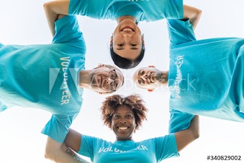 Group of happy and diverse volunteers