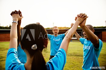 Group of happy and diverse volunteers