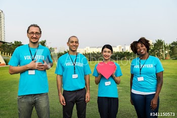 Group of happy and diverse volunteers