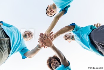 Group of happy and diverse volunteers