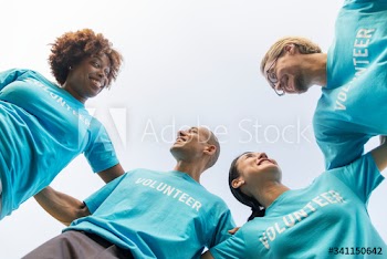 Group of happy and diverse volunteers
