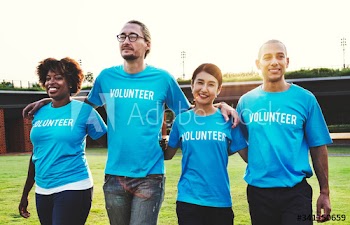 Group of happy and diverse volunteers