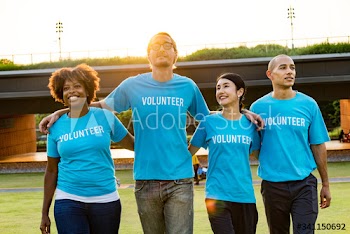 Group of happy and diverse volunteers