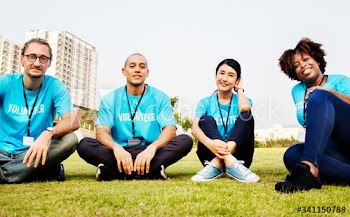 Group of happy and diverse volunteers