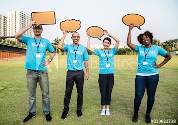 Group of happy and diverse volunteers with speech bubbles