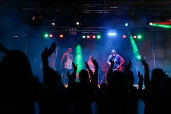 Group Of Men Performing On Stage 