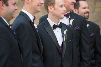 Group of Men Wearing Black Suit Jackets Smiling Outdoors