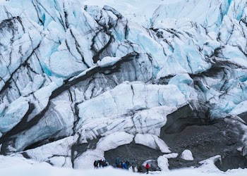 group of mountaineers hiking on snowy mountain