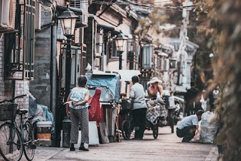 Group of People Beside Street