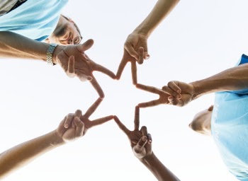 Group of People Doing Star Handsign