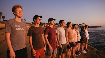 Group of People Facing Sea