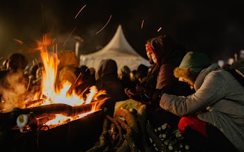 Group Of People Gathered Near Bonfire