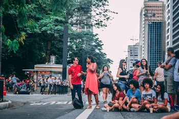 Group Of People Gathering In The Street