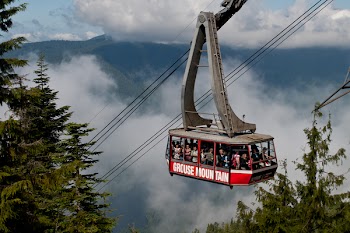 Group of People Going Up to Mountain