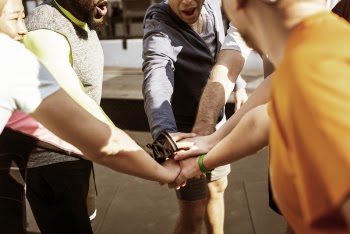 Group of People Holding Hands Together