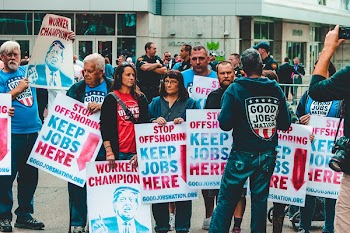 Group of People Holding Posters