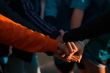 Group of People Huddling Up · Free Stock Photo