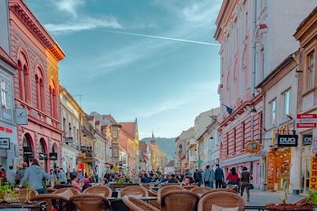 group of people in between buildings