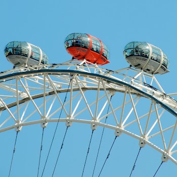 Group of People in Red and White Themed Park Ride Duyring Daytime