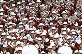 Group of People in White Hat Playing Together Different Kinds of Musical Instruments